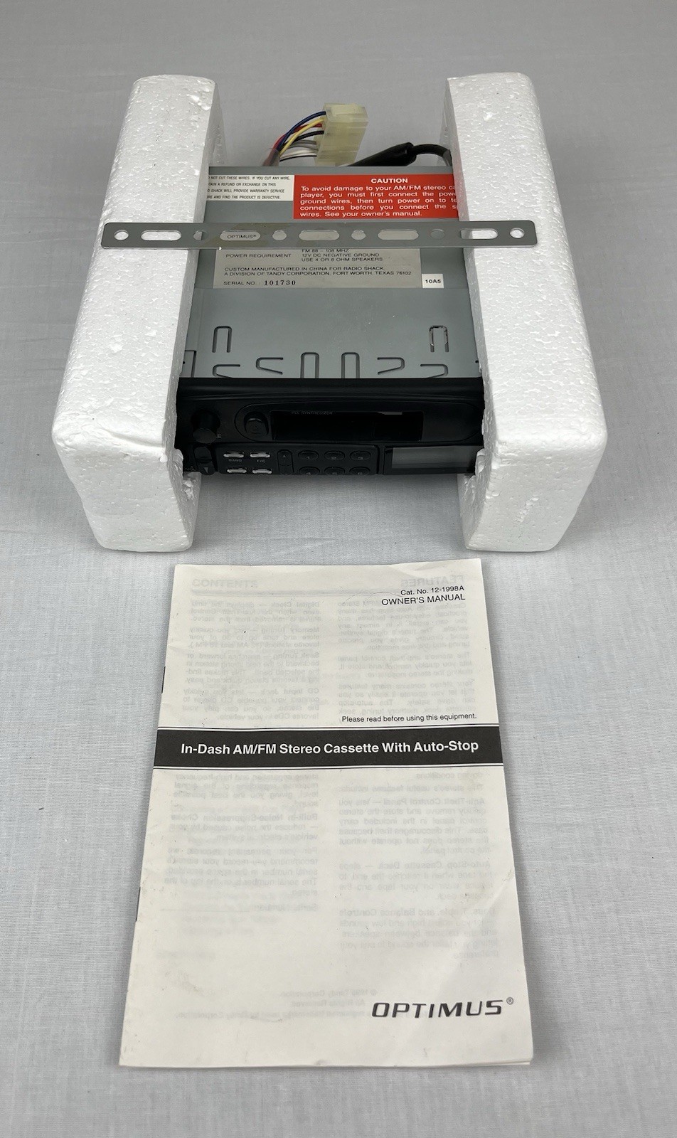Optimus AM/FM Stereo Cassette with Auto Stop In Dash Detachable Face 12-1998A