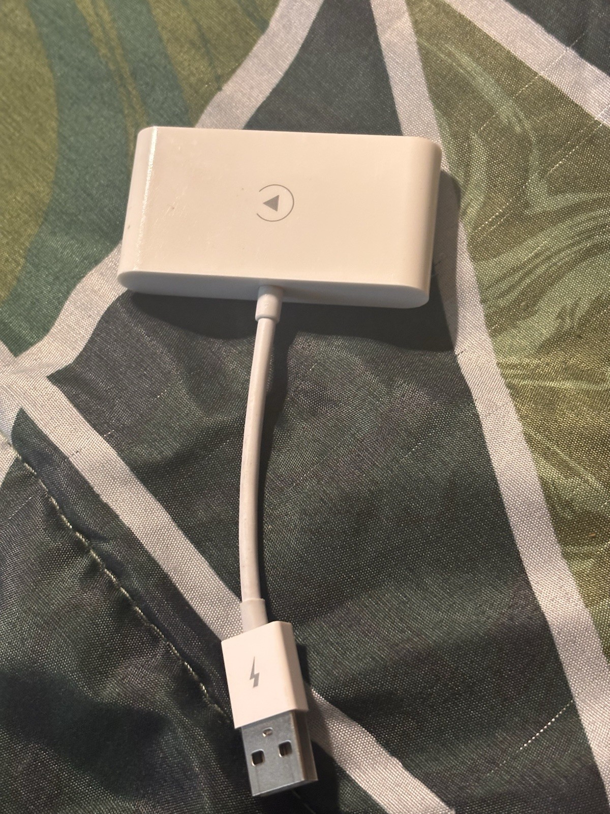 Apple CarPlay adapter used to convert a wired CarPlay system to a wireless one.
