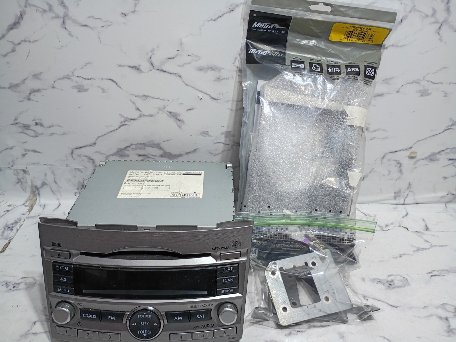 Subaru Legacy / Outback OEM CD MP3 WMAw/ OEM Mounting Brackets & Metra Dash Kit