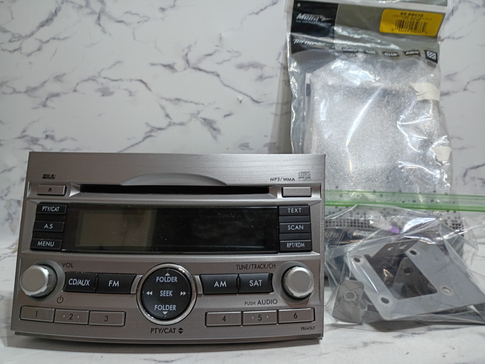 Subaru Legacy / Outback OEM CD MP3 WMAw/ OEM Mounting Brackets & Metra Dash Kit