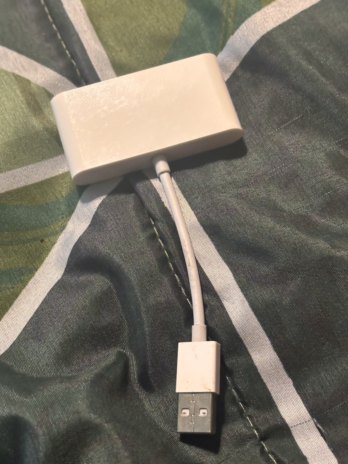 Apple CarPlay adapter used to convert a wired CarPlay system to a wireless one.