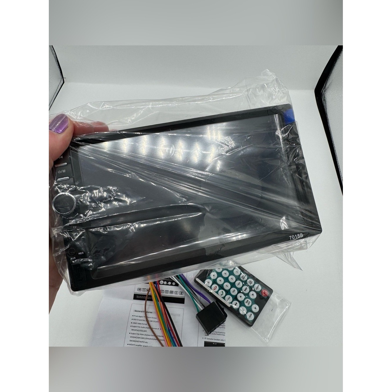 Amazon 7010B model car multimedia player with a 7-inch touch screen black