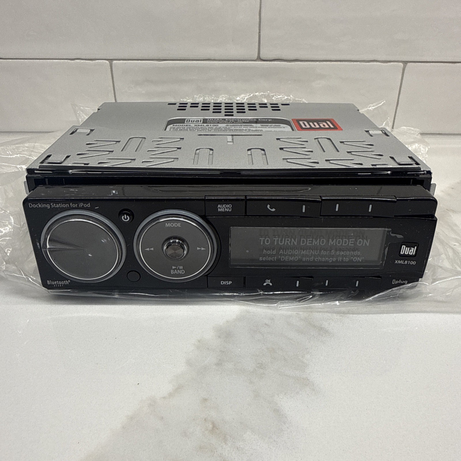 Dual Electronics XML8100 AM/FM Car Dashboard Mechless Receiver with iPod Docking
