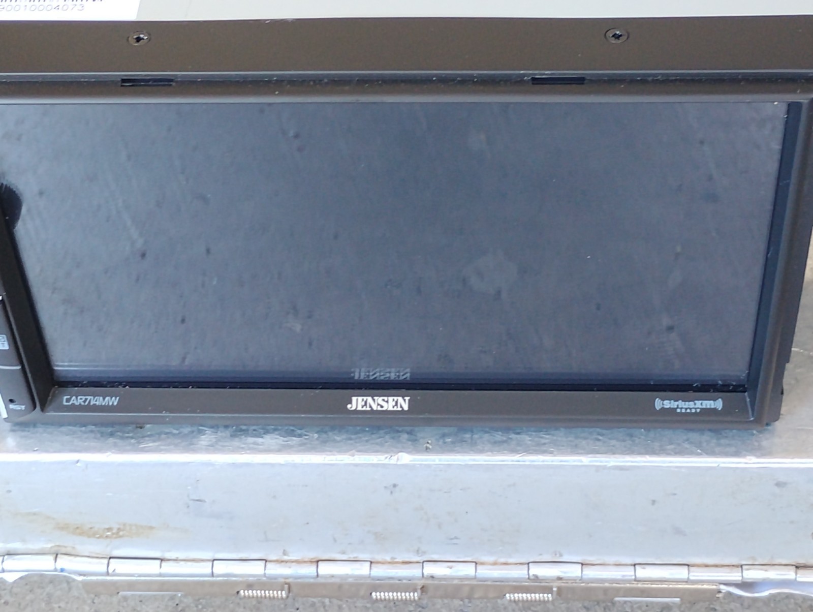 Car radio Jensen with harness and Sirius XM Connect Tuner. 7 inch touchscreen.