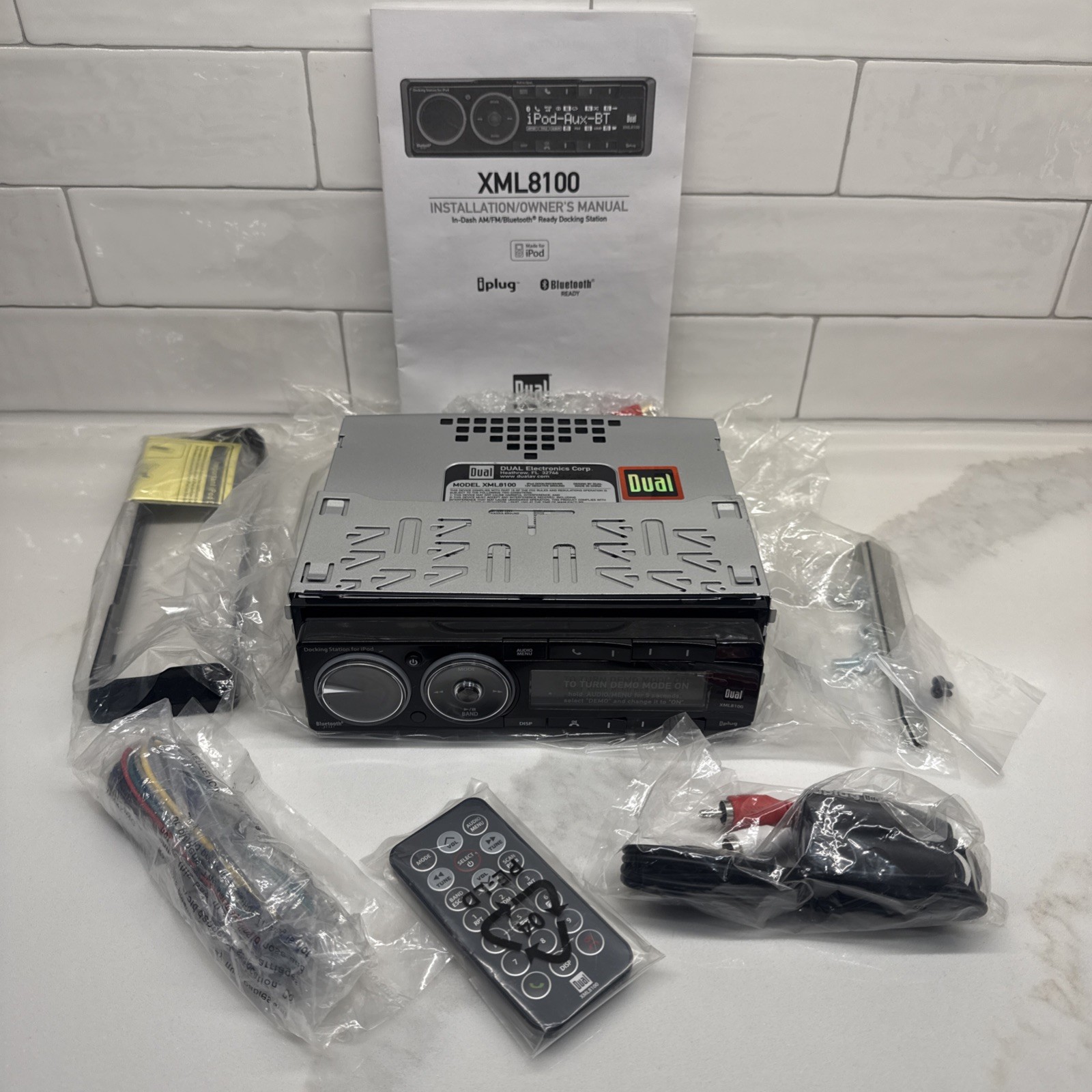 Dual Electronics XML8100 AM/FM Car Dashboard Mechless Receiver with iPod Docking