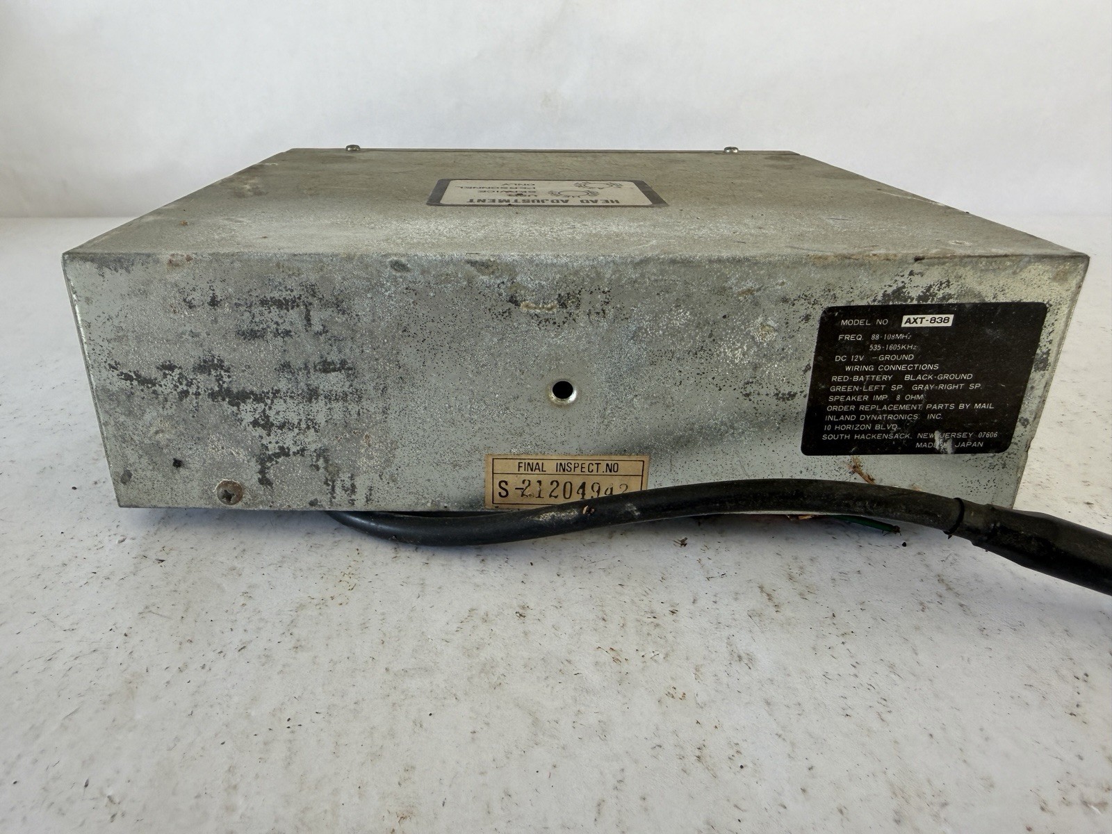 Inland Dynatronics Inc. vintage in-dash car stereo with an 8-track player
