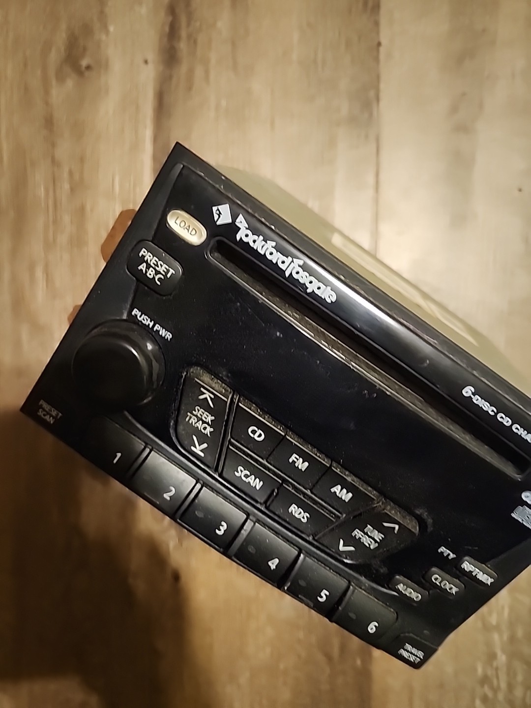 02-04 Nissan Xterra Frontier AM FM six-disc CD radio receiver Rockford Fosgate.