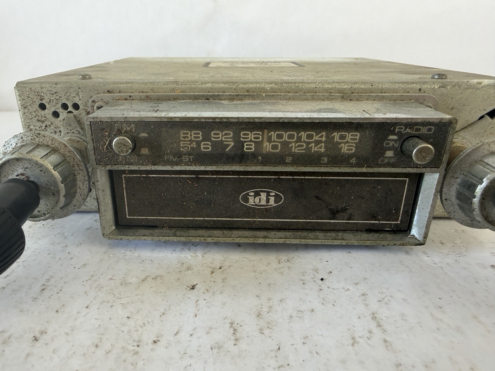 Inland Dynatronics Inc. vintage in-dash car stereo with an 8-track player