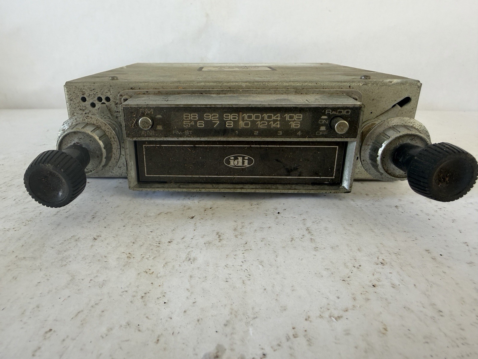 Inland Dynatronics Inc. vintage in-dash car stereo with an 8-track player