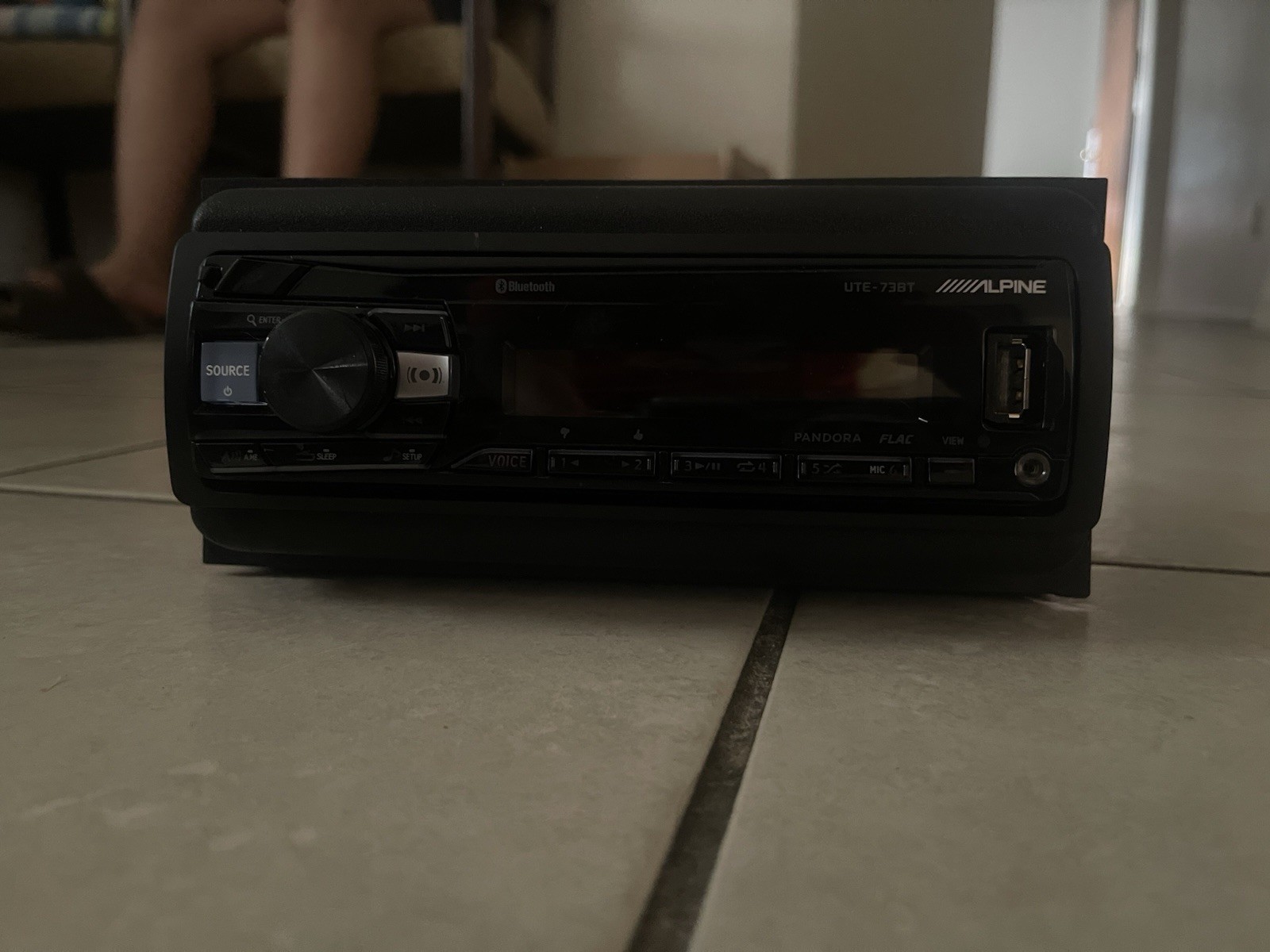 Alpine UTE-73BT digital media receiver, designed for car audio systems.